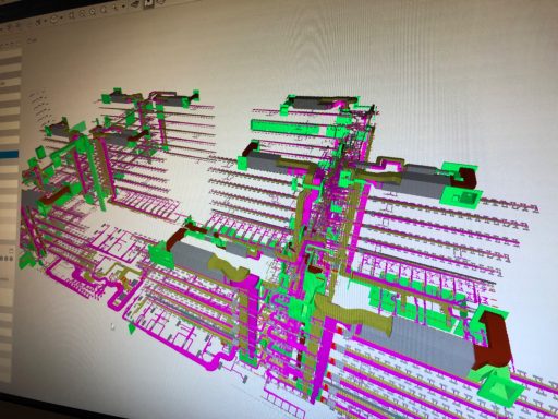 Grafische Darstellung eines technischen Layouts mit farbigen Ebenen und Strukturen.